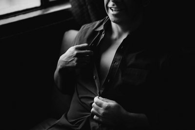 A men's boudoir session with an unbuttoned shirt