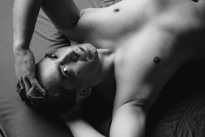 Man Laying on Back for Boudoir Session