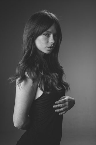 Hattie Watson in a Black Shirt