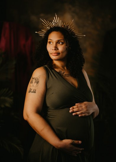 New Mom Wearing a Crown in Maternity Photosession