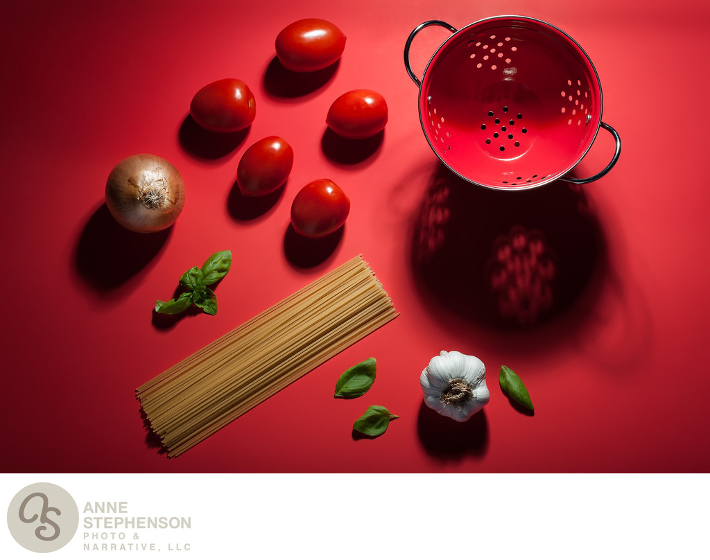 Scene showing ingredients used to make pasta and sauce