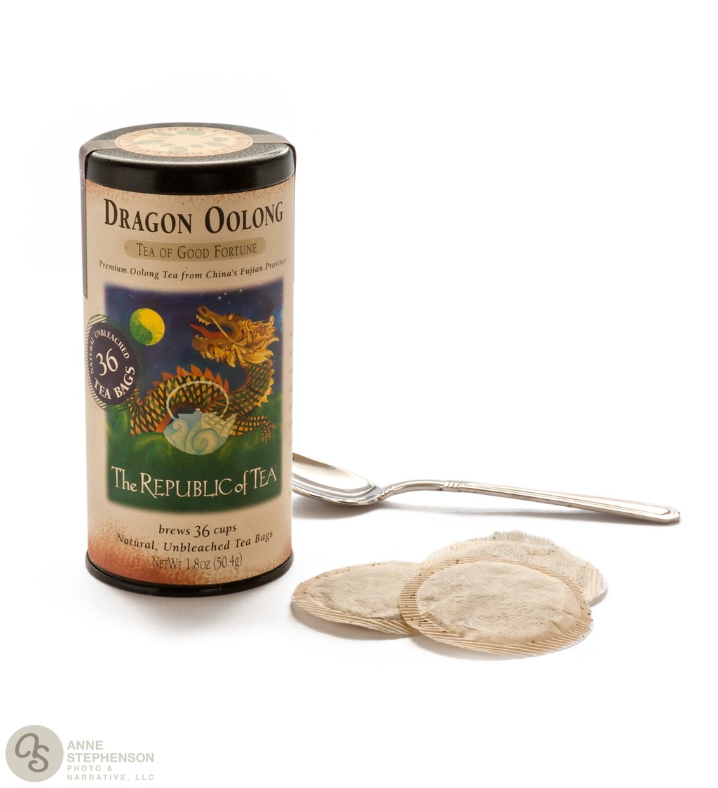 Dragon OOlong Tea tin and bags on a white background