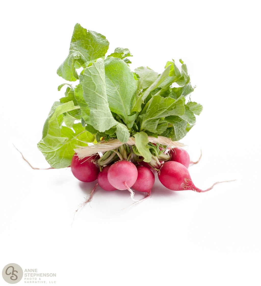 Red radishes on a white background