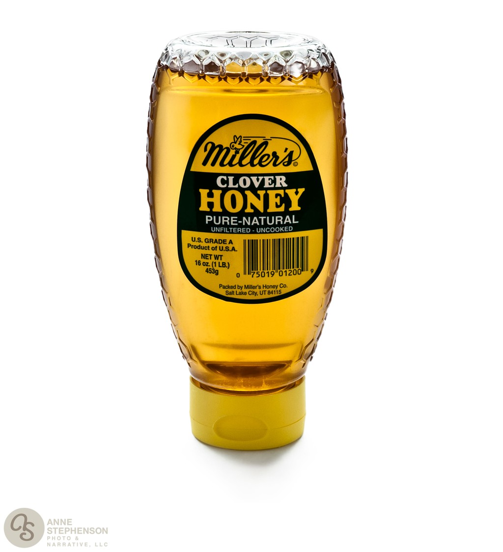 Bottle of Millers Clover Honey on white background