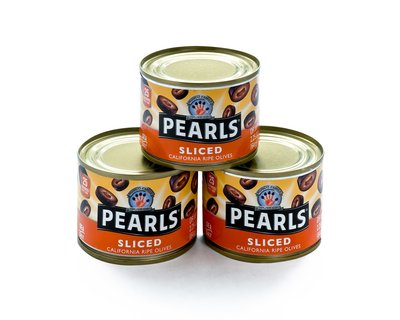 Cans of sliced olives on white