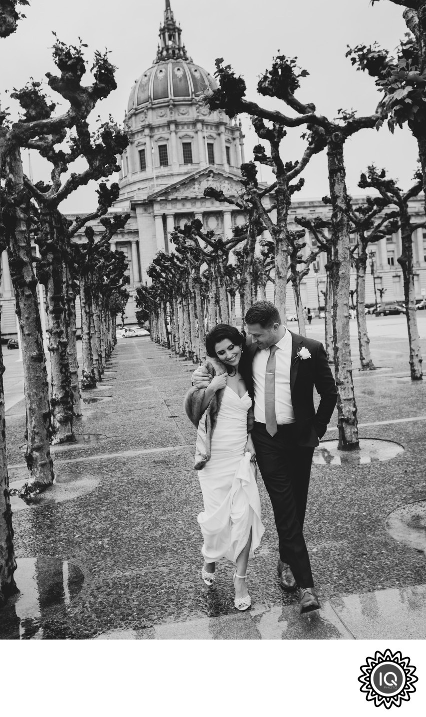 San Francisco City Hall Wedding Photographer - Couple walking at SF Civic Center