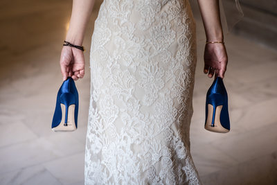 SF City Hall Bride carrying shoes