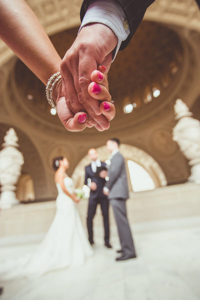 Guests holding hands at SF City Hall Wedding