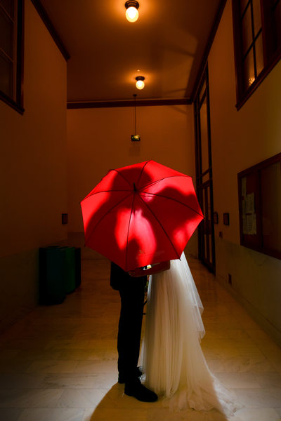 Couple under the umbrella at the county clerk office