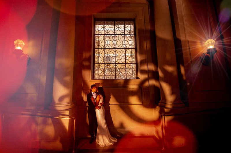 Creative San Francisco City Hall wedding portrait near the Rotunda