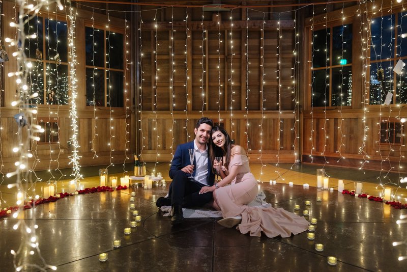 Couple celebrating proposal at Sunnyside Conservatory in San Francisco